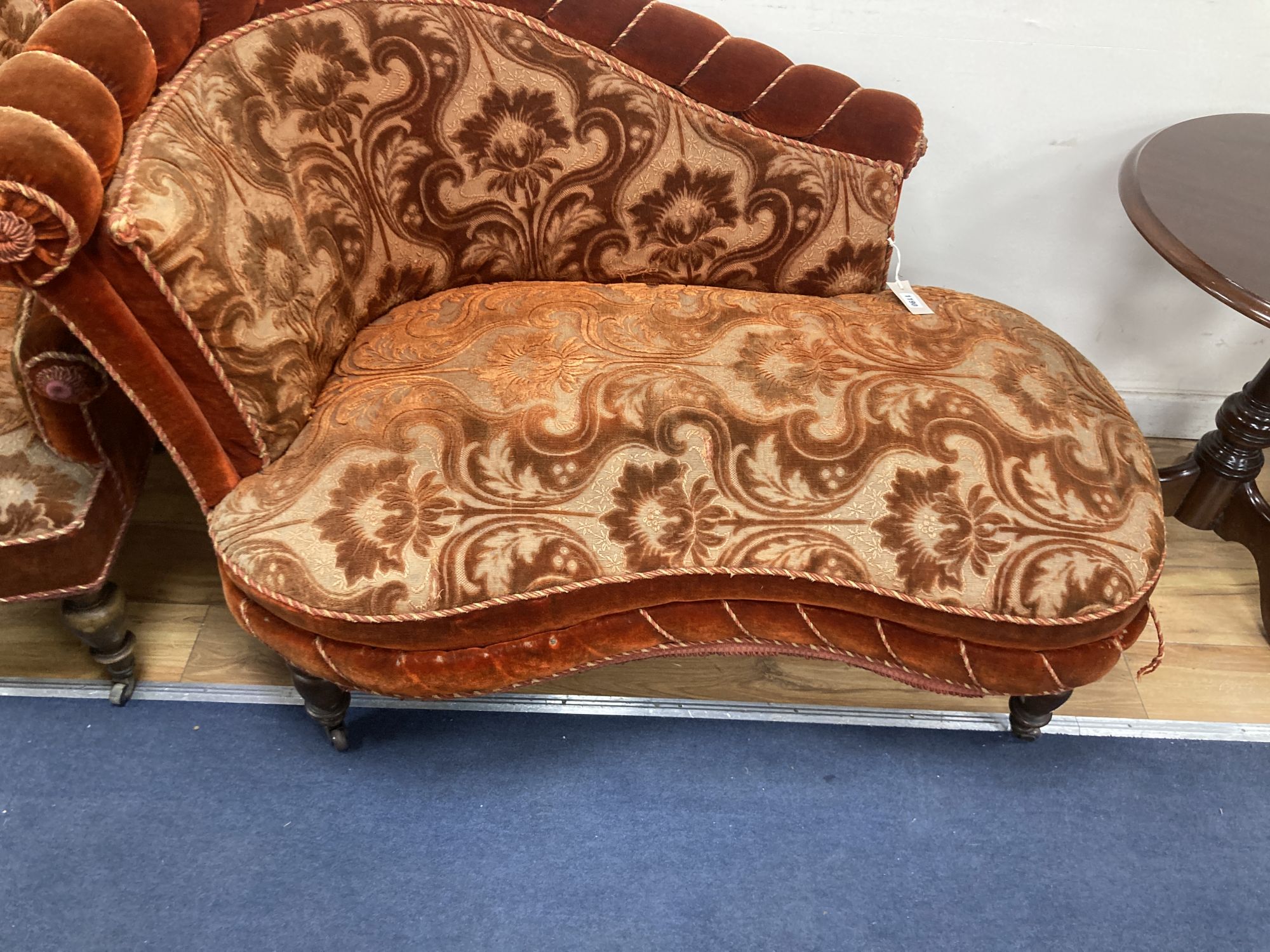 A small Victorian chaise longue, length 120cm, depth 80cm, height 84cm and matching tub framed armchair, each with cut red velvet uphol